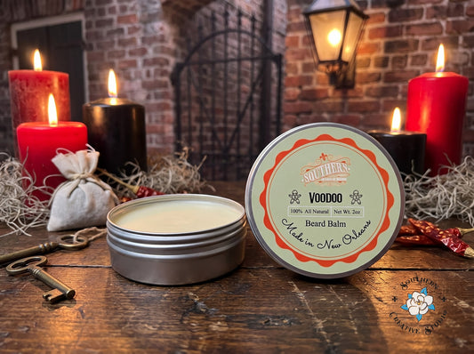 Voodoo beard balm by Southern Creative Studio, open tin and lid with a candle-lit French Quarter apothecary with skeleton keys and Spanish moss