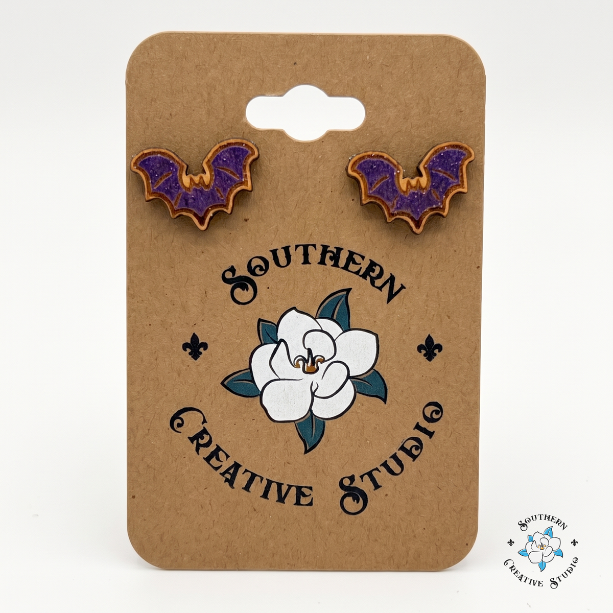 Purple bat wood stud earrings on Southern Creative Studio hang card