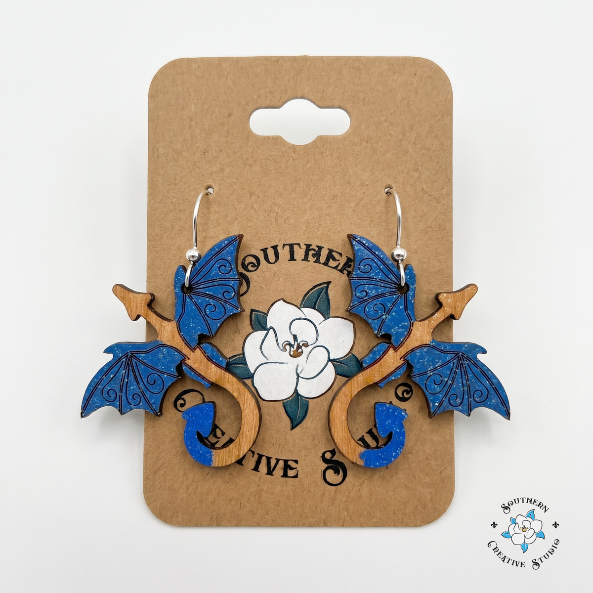 Hand-painted blue dragon wood earrings on Southern Creative Studio kraft hang card