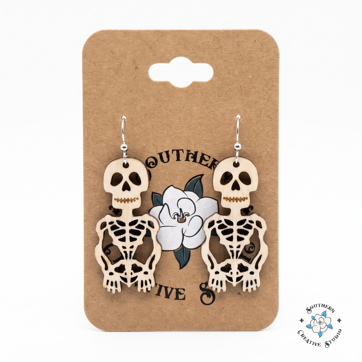 Wood skeleton earrings on Southern Creative Studio hang card