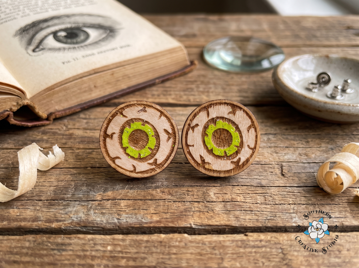 Green eyeball wood stud earrings with eye illustration anatomy book
