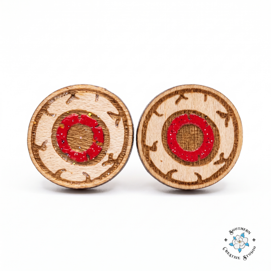 Red eyeball stud earrings, hand-painted wood, on white background
