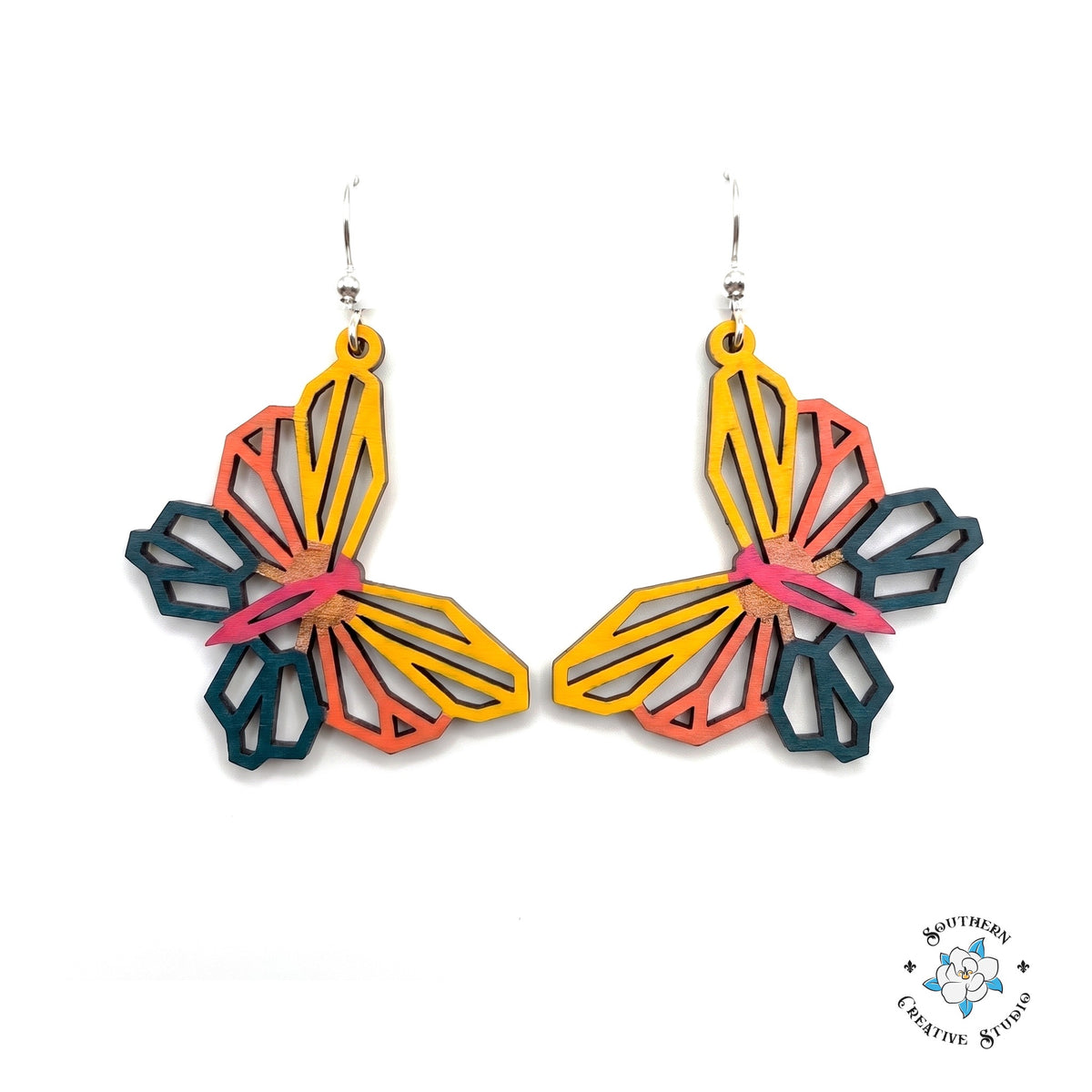 Sunset geometric butterfly earrings, open see-through yellow, coral and teal layered hand-painted wood dangles on white background