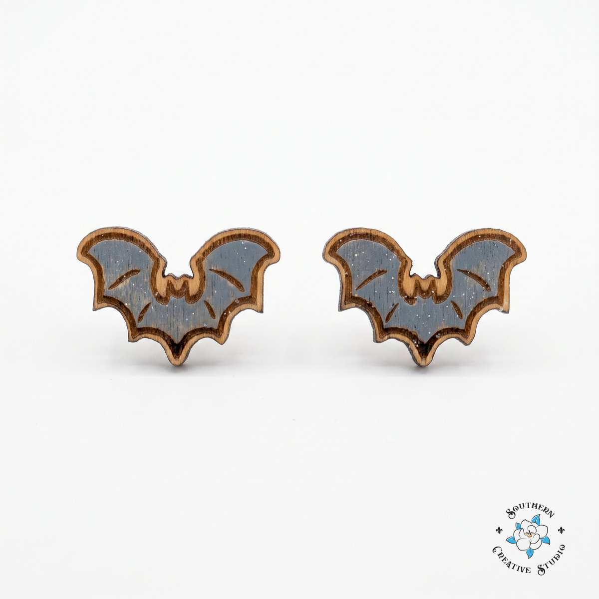 Gray bat wood stud earrings, hand-painted, on white background