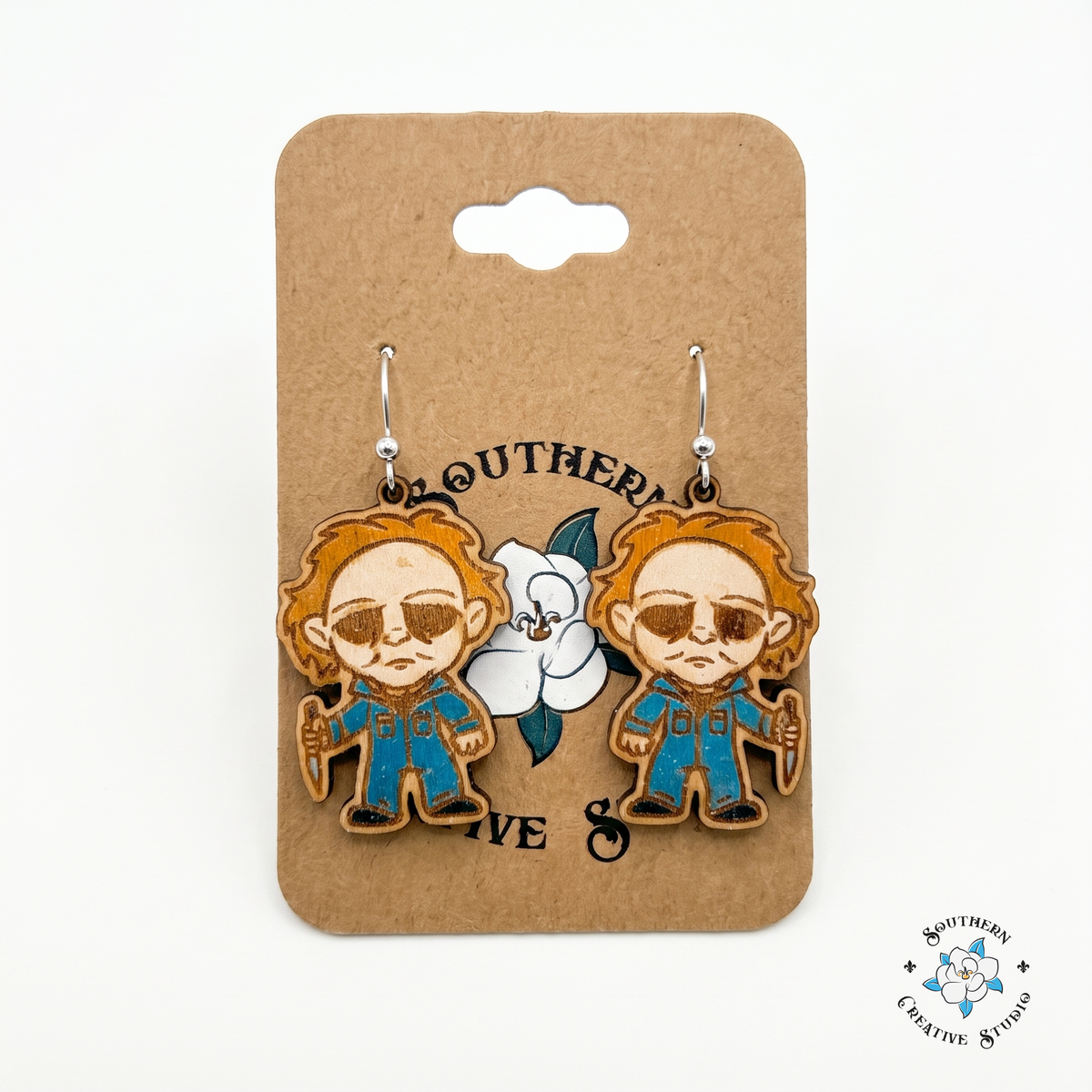 Masked slasher horror wood earrings on Southern Creative Studio hang card