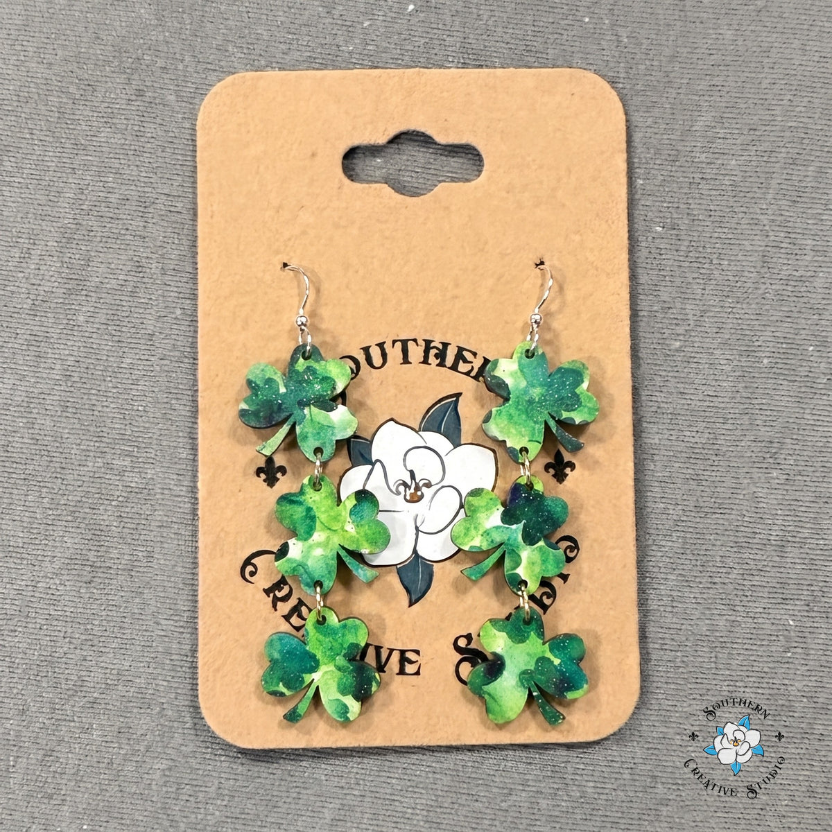 Three leaf clover triple dangle earrings on a Southern Creative Studio earring card