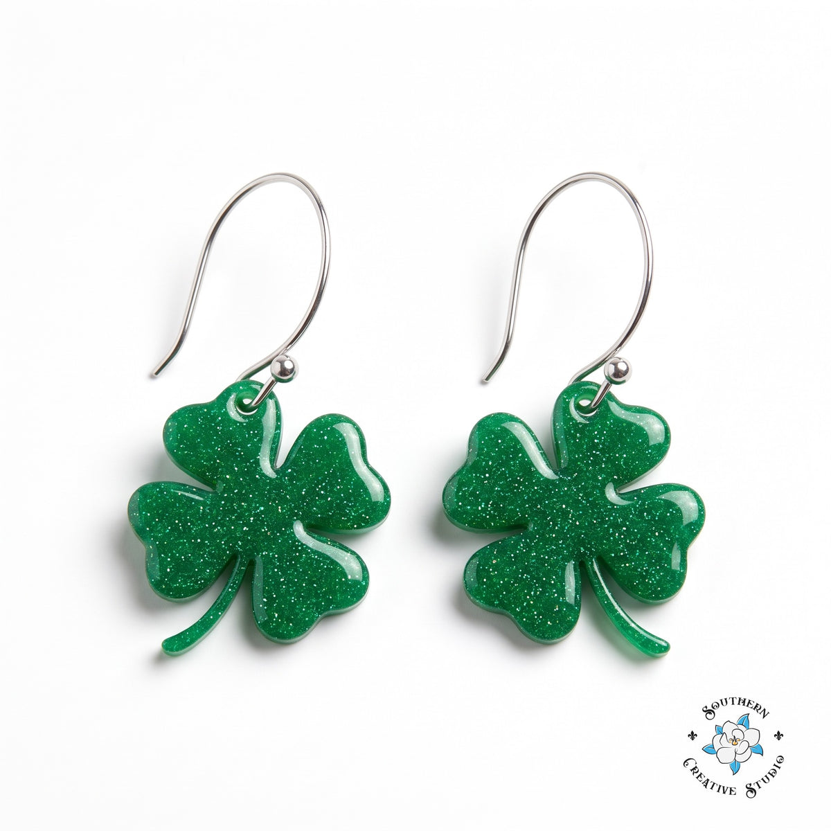 St. Patrick's emerald green four leaf clover earrings on white