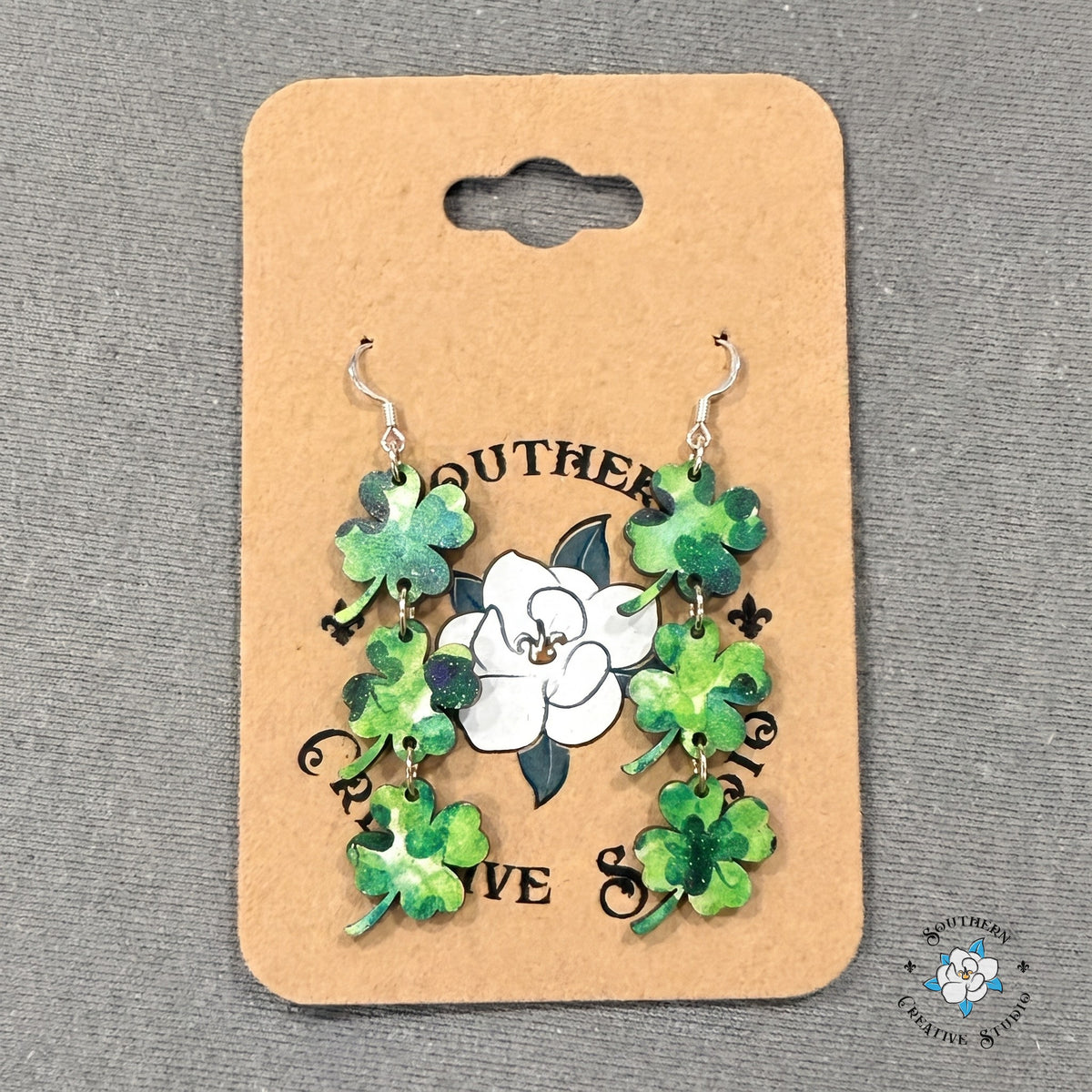 Four leaf clover triple dangle earrings on a Southern Creative Studio earring card