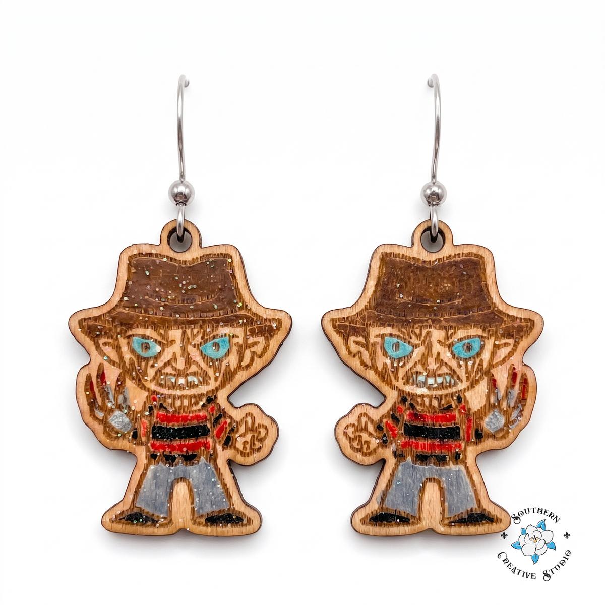 Striped sweater slasher wood earrings with fedora, blue eyes and silver claw glove on white background