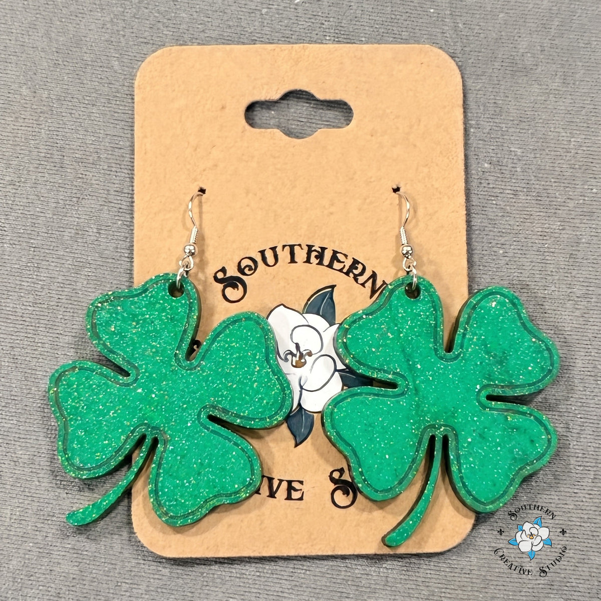 Large four leaf clover earrings on a Southern Creative Studio earring card