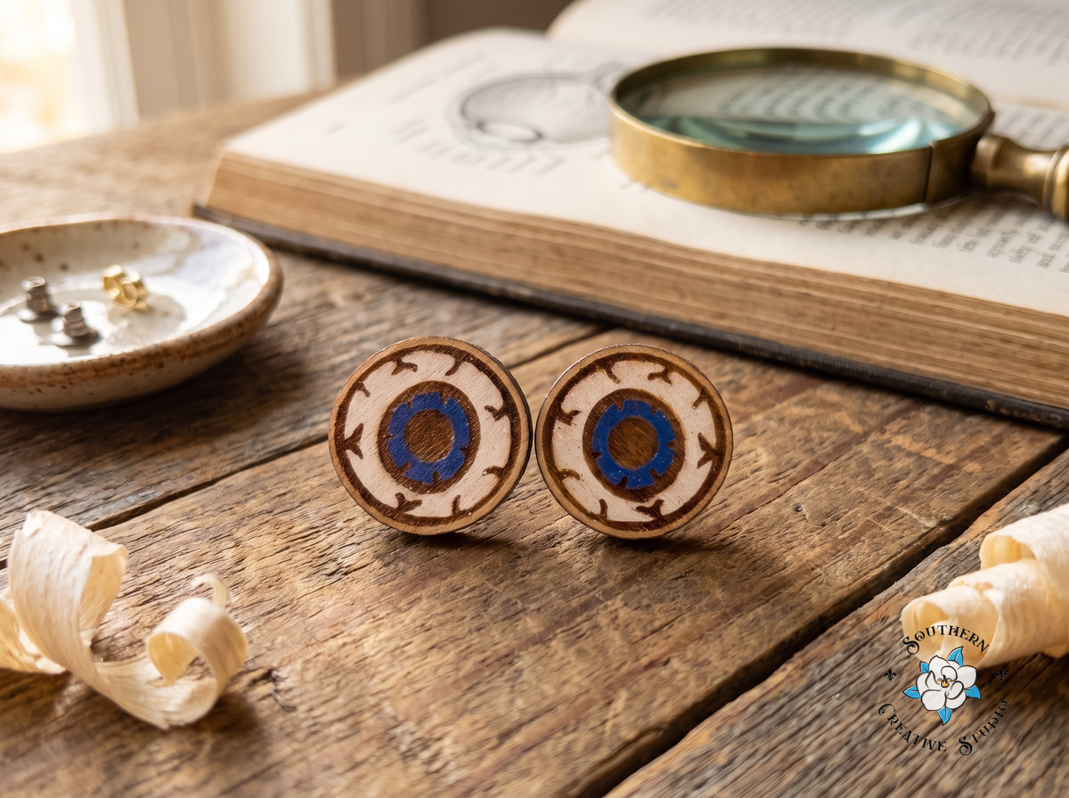 Hand-painted wood eyeball stud earrings with anatomy book and magnifying glass