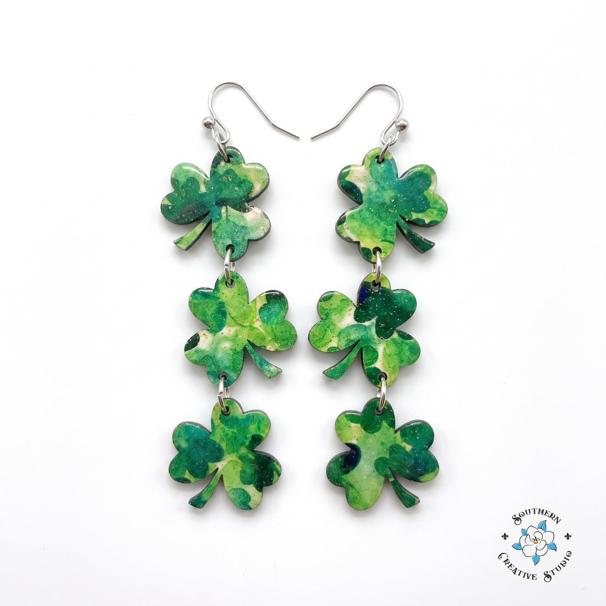 St. Patrick's marbled three leaf clover triple dangle earrings on white