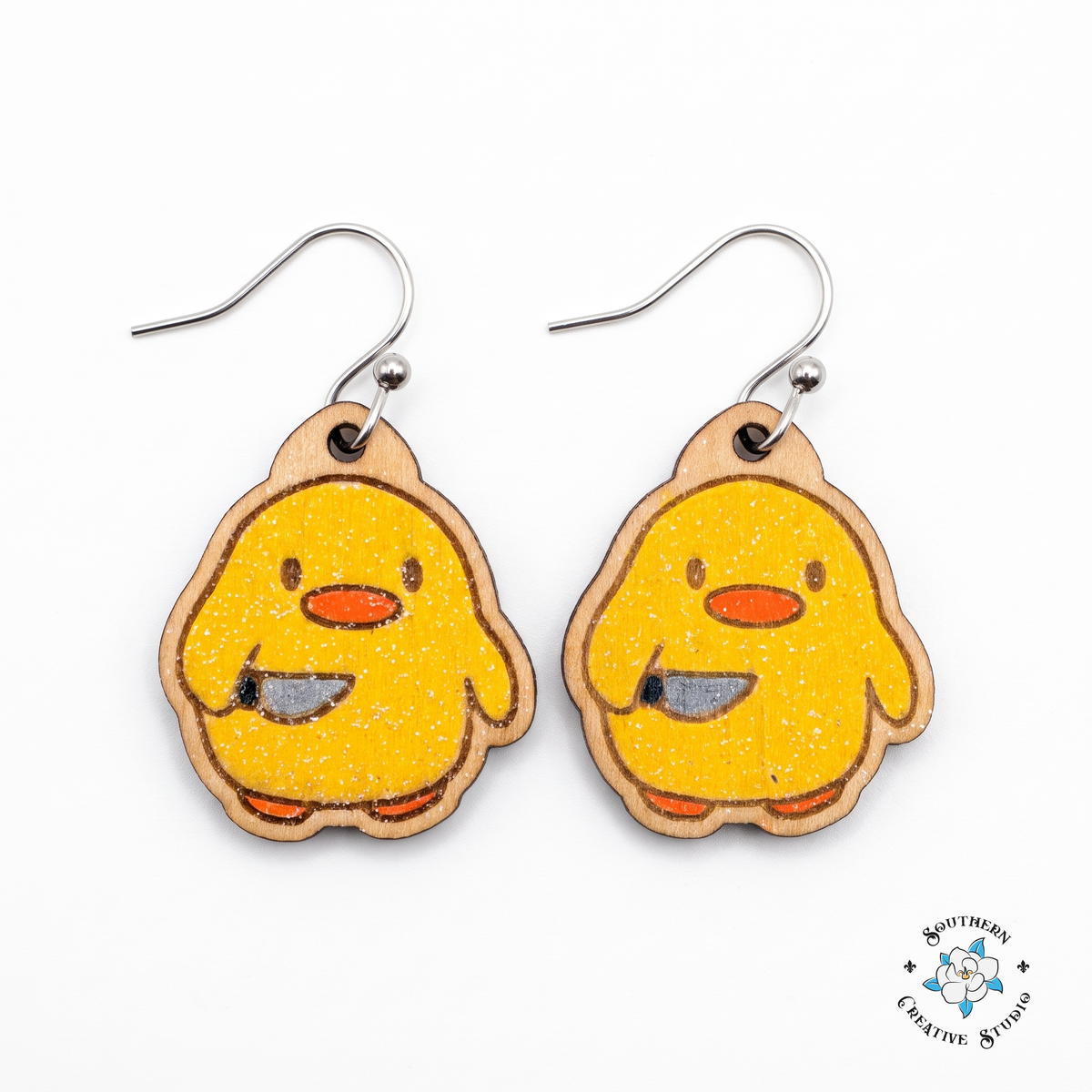Duck with knife earrings hand-painted wood yellow chick dangle on white background