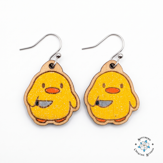 Duck with knife earrings hand-painted wood yellow chick dangle on white background