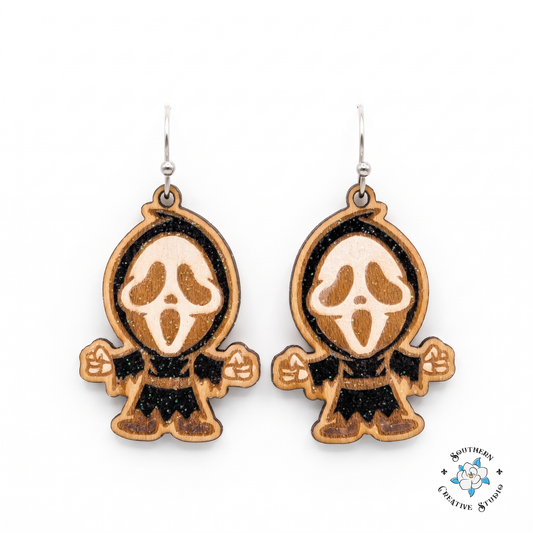 Hand-painted wood screaming ghost mask dangle earrings on white background