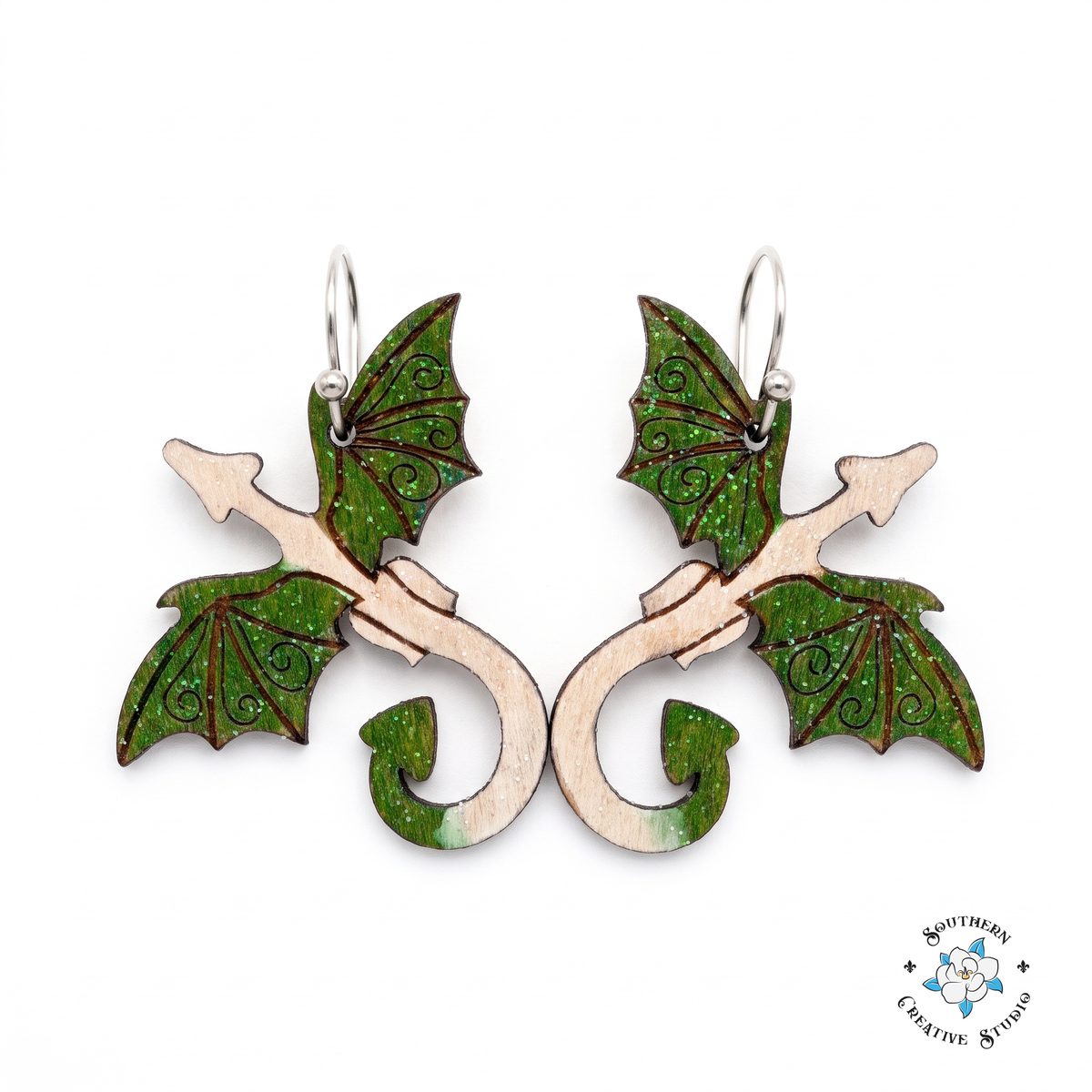 Forest green dragon hand-painted wood dangle earrings with emerald wings on white background