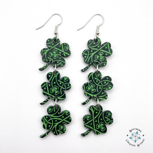 St. Patrick's Celtic knot four leaf clover triple dangle earrings on white