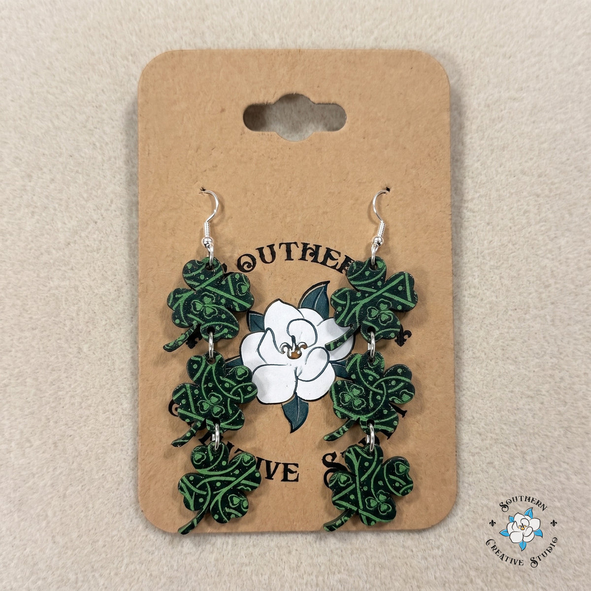 Celtic knot clover dangle earrings on a Southern Creative Studio earring card