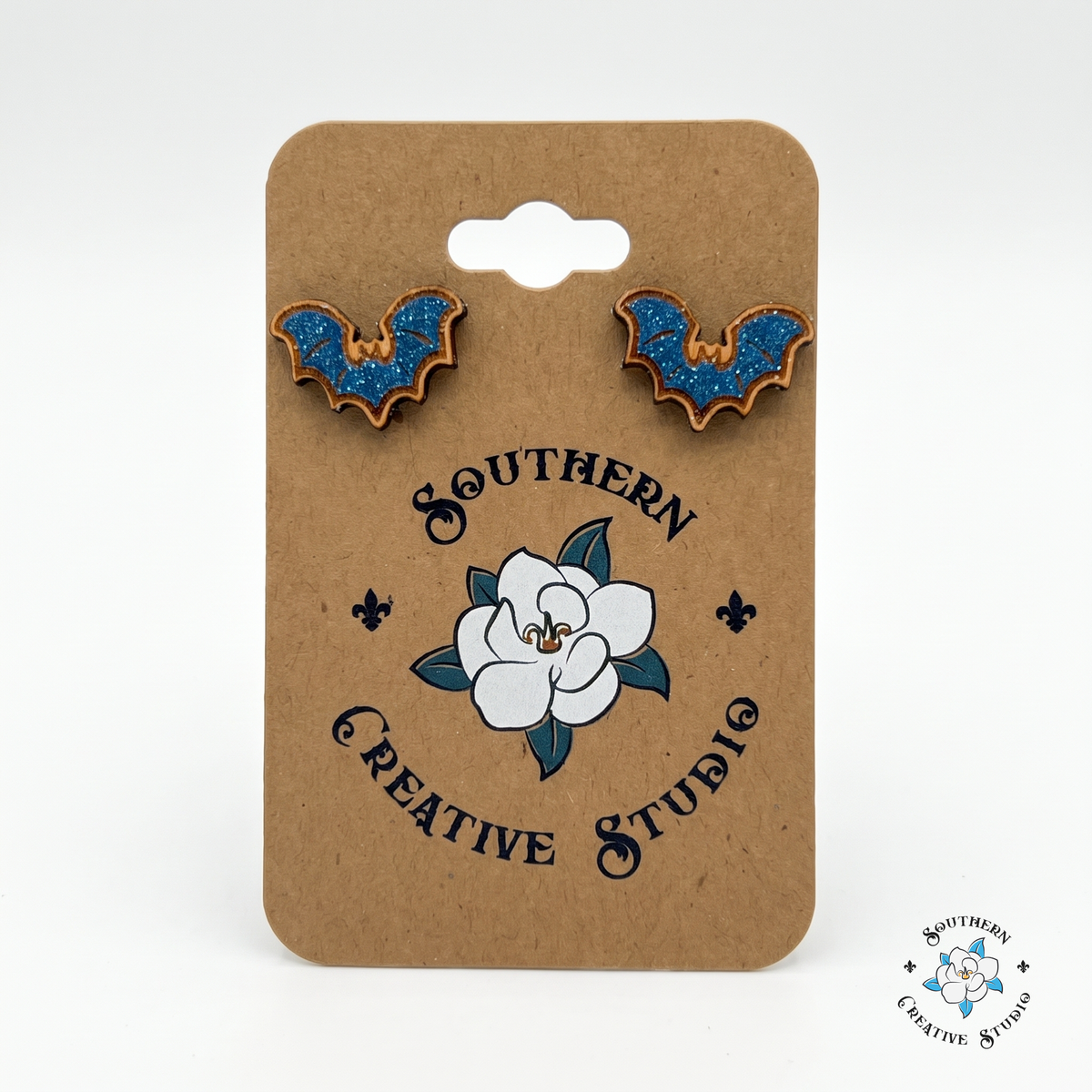 Blue bat wood stud earrings on Southern Creative Studio hang card
