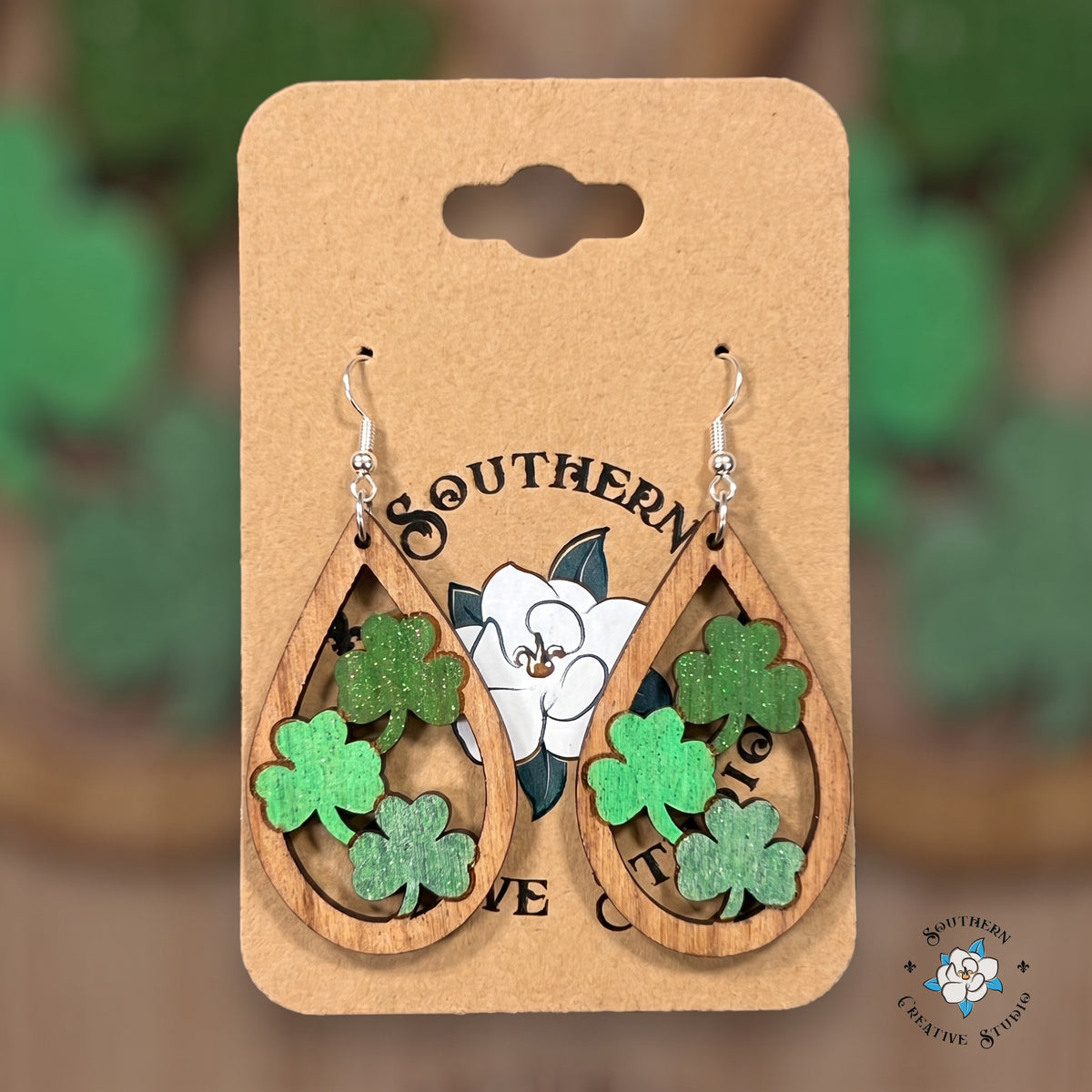 Three clover teardrop earrings on a Southern Creative Studio earring card