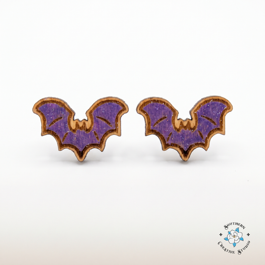 Purple bat wood stud earrings, hand-painted, on white background