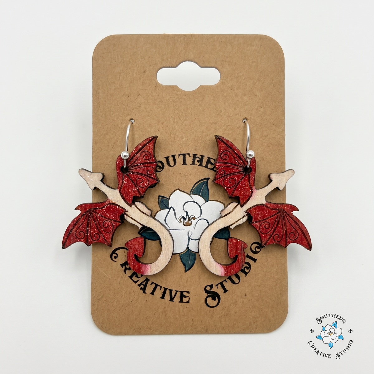 Hand-painted red dragon wood earrings on Southern Creative Studio kraft hang card