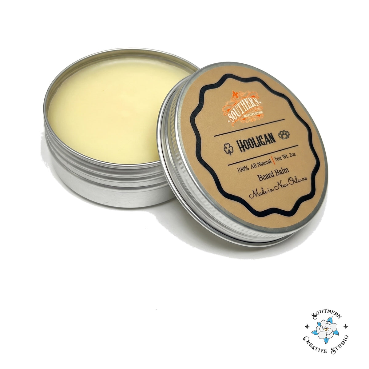 Southern Creative Studio Hooligan beard balm, open 2 oz tin with lid on white background