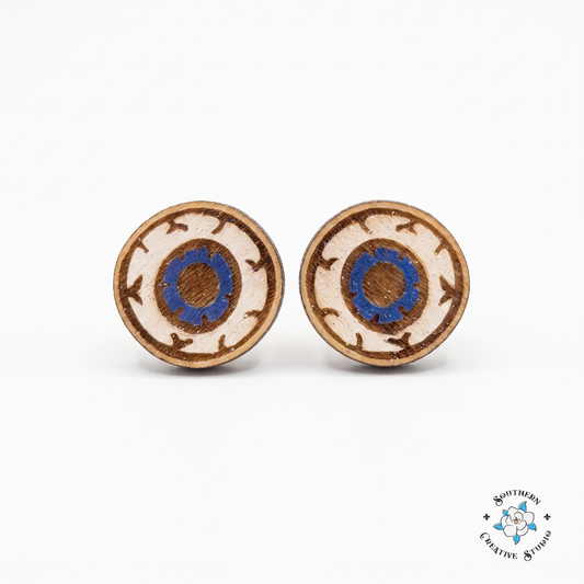 Eyeball stud earrings hand-painted wood with blue iris and etched veins on white background