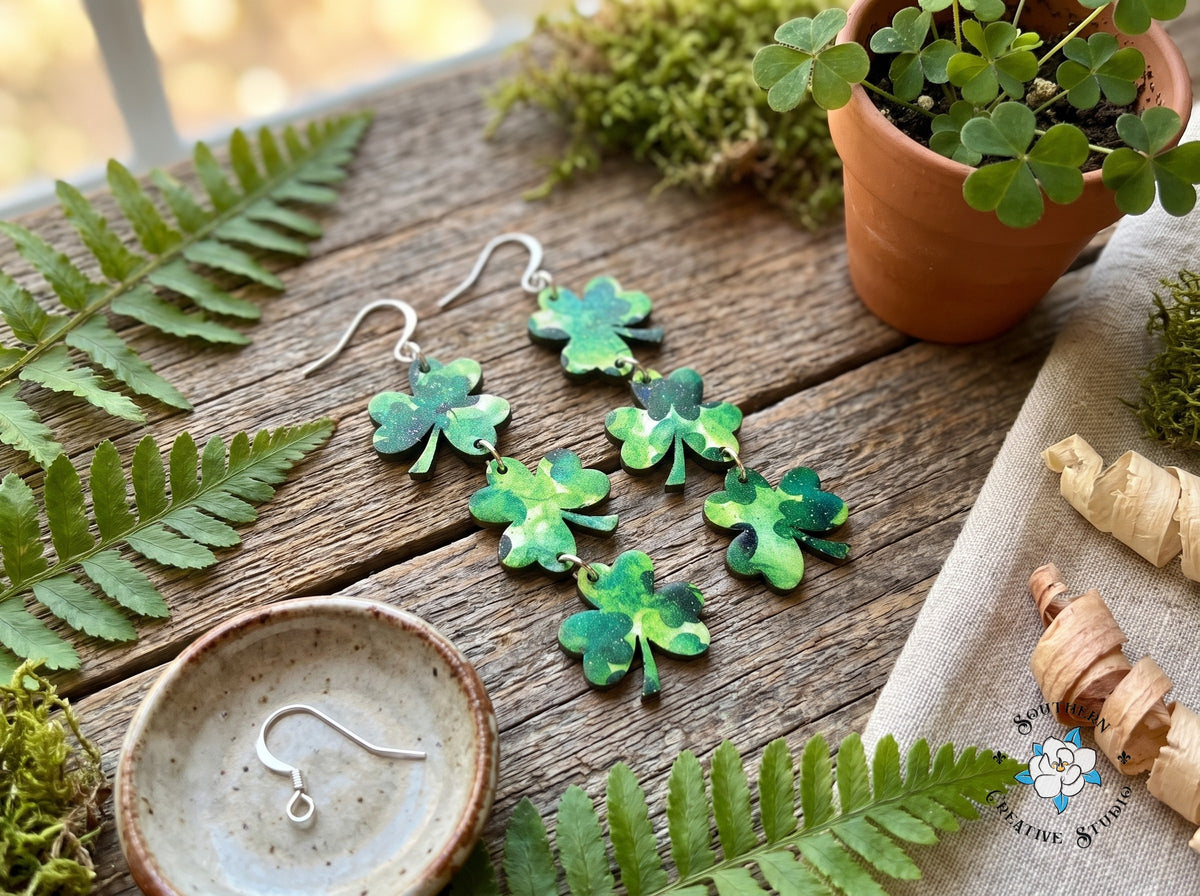 Long three leaf clover dangle earrings styled with ferns, moss and shamrocks
