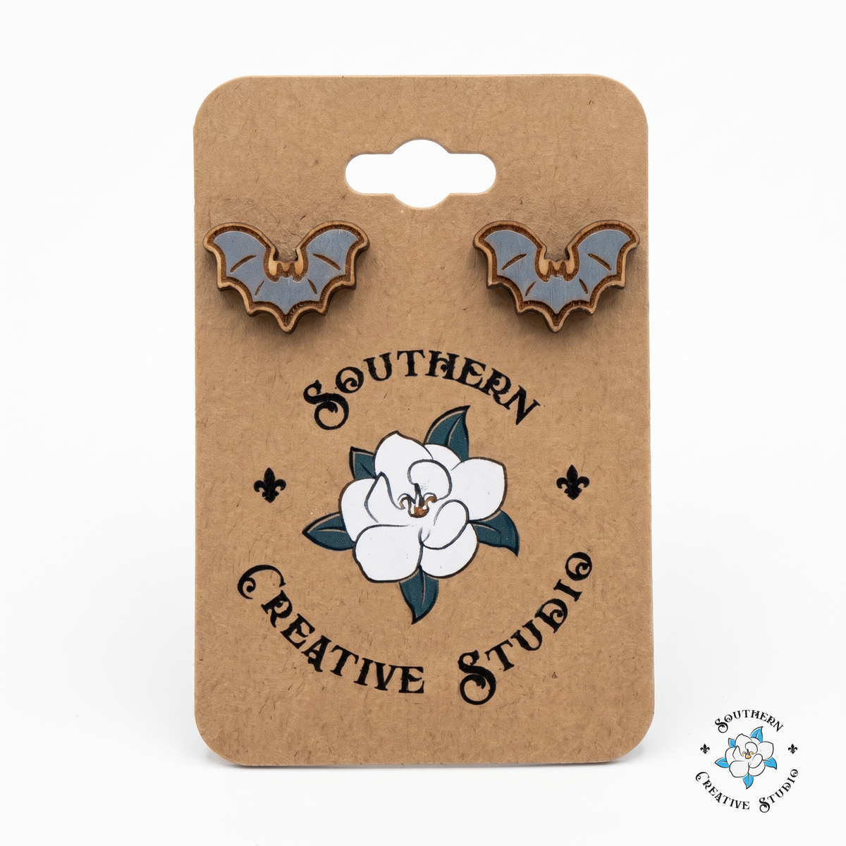 Gray bat wood stud earrings on Southern Creative Studio hang card