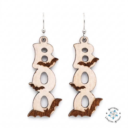 Hand-painted wood BOO bat dangle earrings on white background