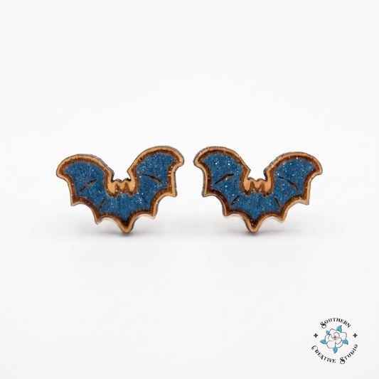 Blue bat wood stud earrings, hand-painted, on white background
