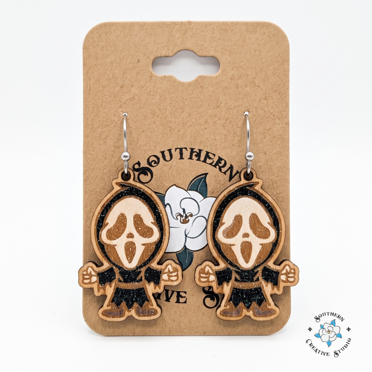 Screaming ghost mask earrings on Southern Creative Studio magnolia hang card