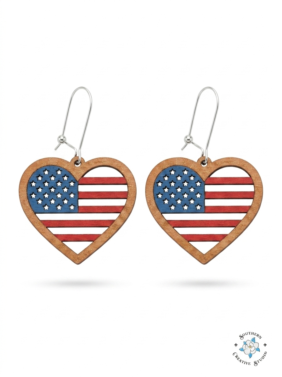 American flag heart dangle earrings hand-painted wood with star cutouts on white background