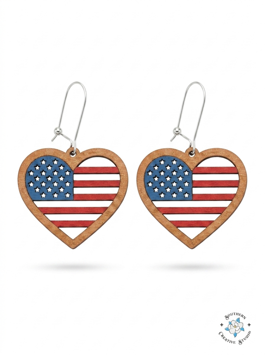 American flag heart dangle earrings hand-painted wood with star cutouts on white background