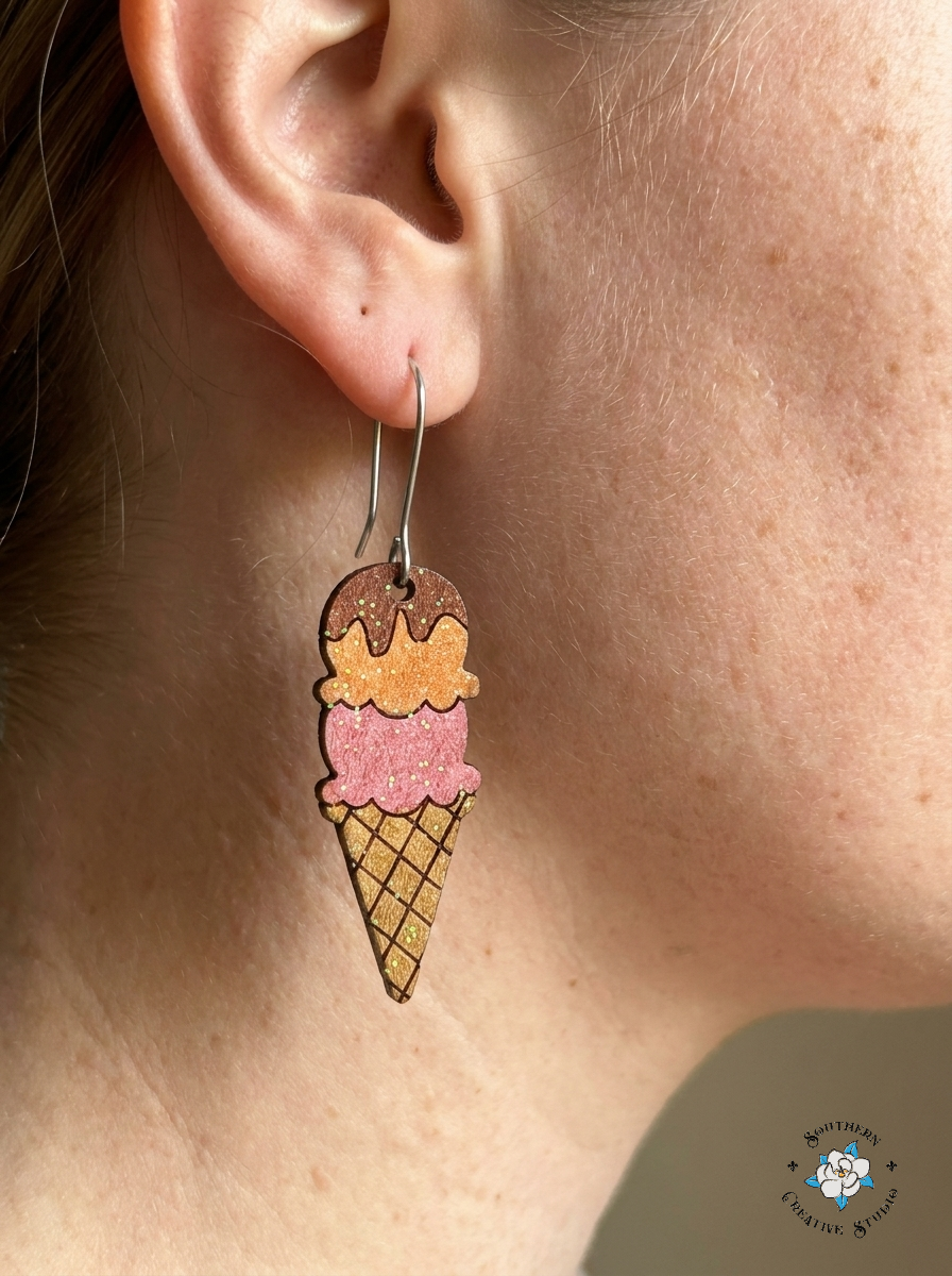 Close up of Ice Cream Cone hand-painted wood earring on ear