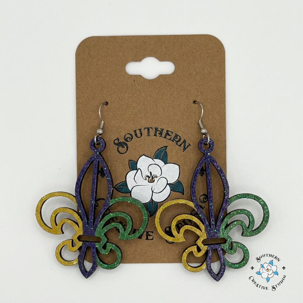 Mardi Gras Fleur-de-Lis earrings on Southern Creative Studio card – purple green gold glitter wood